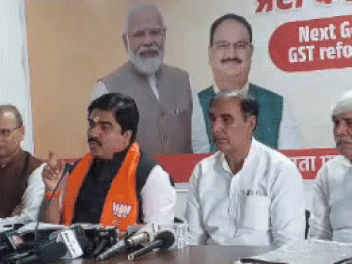 BJP national spokesperson Prem Shukla talking to reporters in Rohtak.