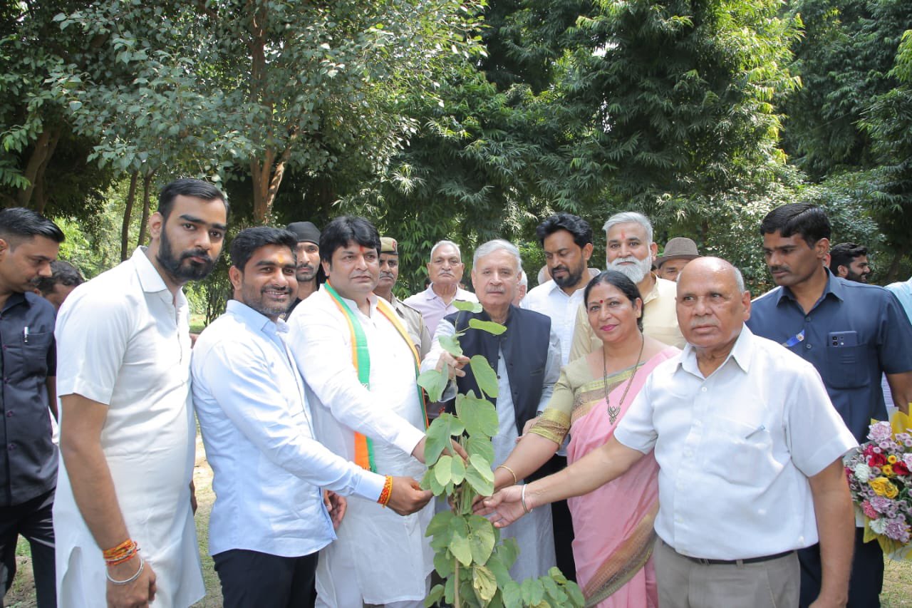 Union Minister Rao Inderjit Singh planting saplings at a program organized in Sector 31 in Gurugram