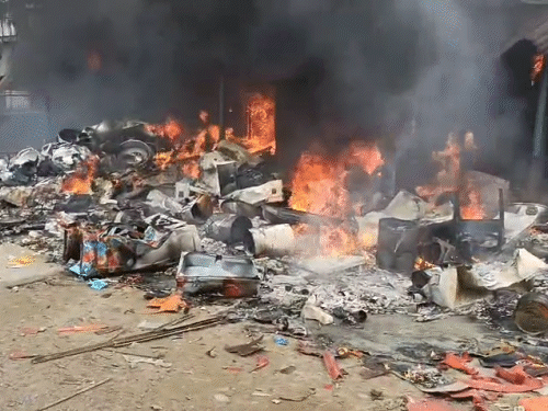 The mob has set fire to shops in front of the temple for not taking the young man out of the community hall.