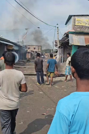 The crowd has also vandalized many nearby houses and shops.