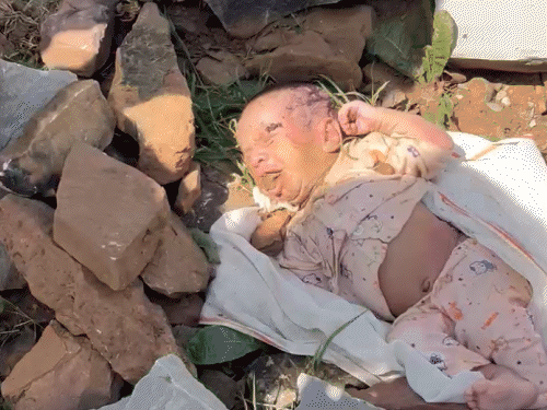 The cattle grazer brought the child to the hospital from a pile of stones.