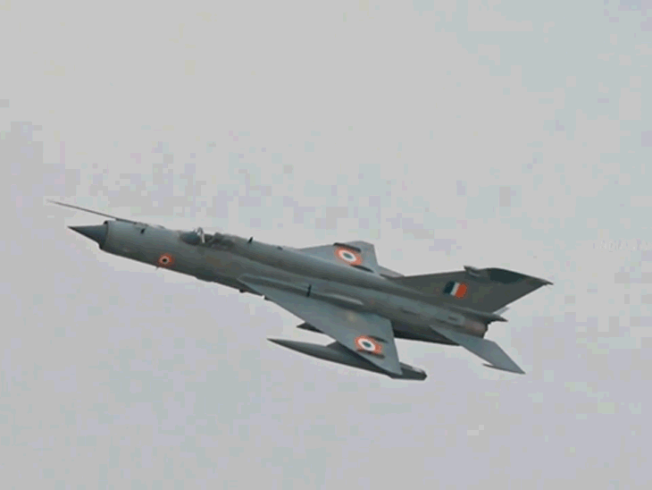 MiG-21 flying in the sky.