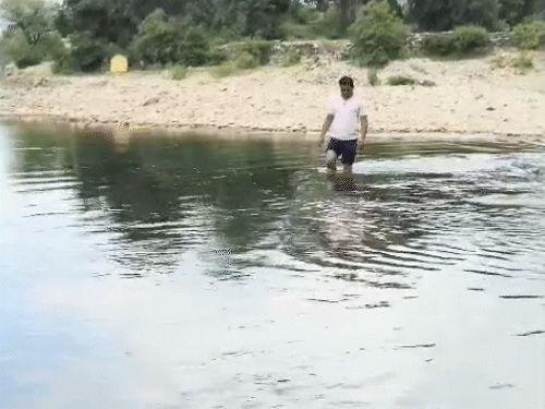 Teacher Dinesh Bairava goes to school to make children appear across the drain.
