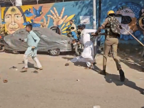 The policemen ran and beat the crowd.