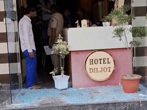 Police investigating at Hotel Diljot after firing. - File photo
