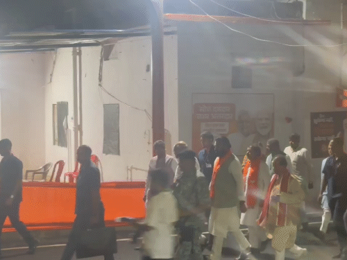 Amit Shah goes for a meeting inside the BJP office. Both his deputy CMs were also present.