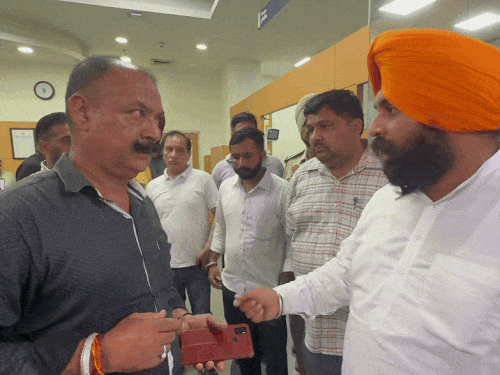 Education Minister Bains in the hospital talking to Timardar who came with the patient.