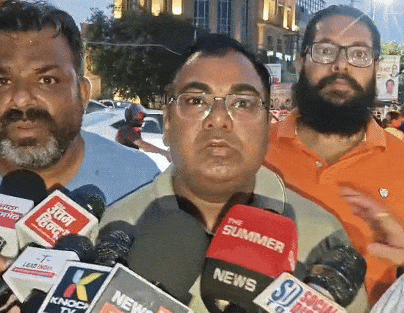 Yogesh Kumar talking to the media.