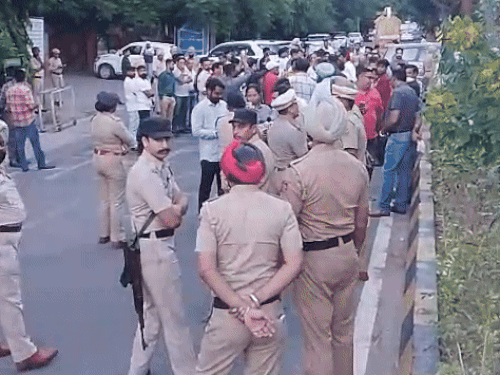 BJP leader and heavy police force stationed on a dharna outside the DC office.