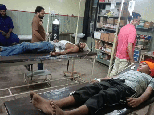 Medical staff treating hospitalized injured people.