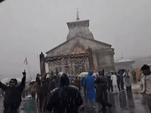 People passing through snowfall in Kedarnath and heavy rains in Nainital.