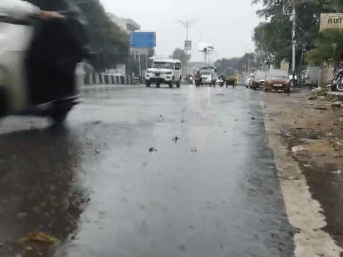 Vehicles passing amidst heavy rains in Dehradun.