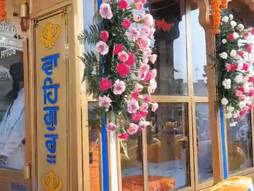Sangat was gathered for the darshan of Palki Sahib.