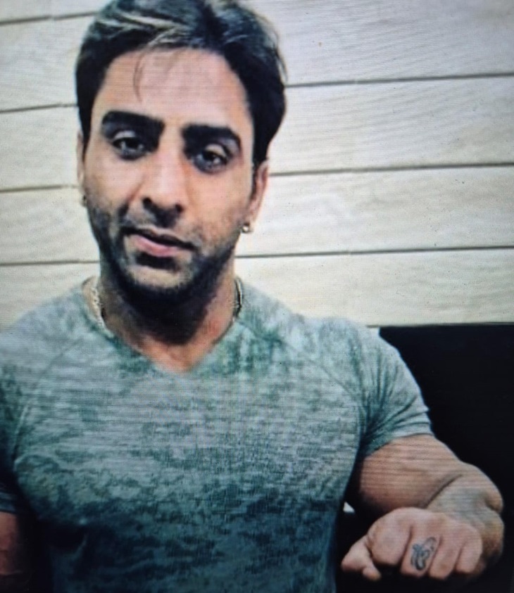 Omkar's tattoo on the middle finger of Varinder's left hand.