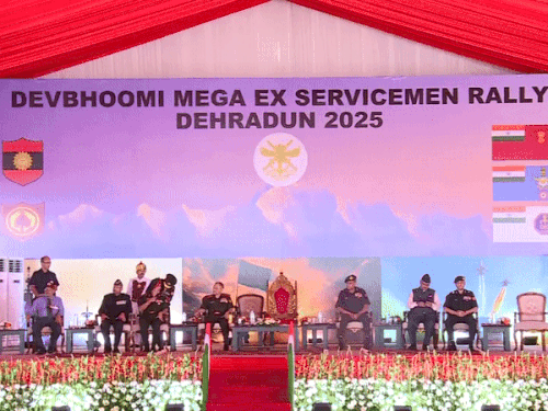 Officers sitting on the stage during the program.