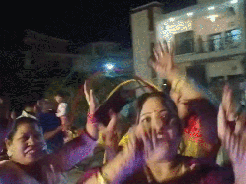 Asha Rani dancing with other women on the day of Karva Chauth.