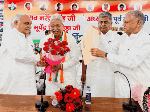 Former Chief Minister Bhupendra Singh Hooda congratulating the newly appointed state president Rao Narendra Singh at Chandigarh Congress Bhawan. Rao Dan Singh had distanced himself from the programme.