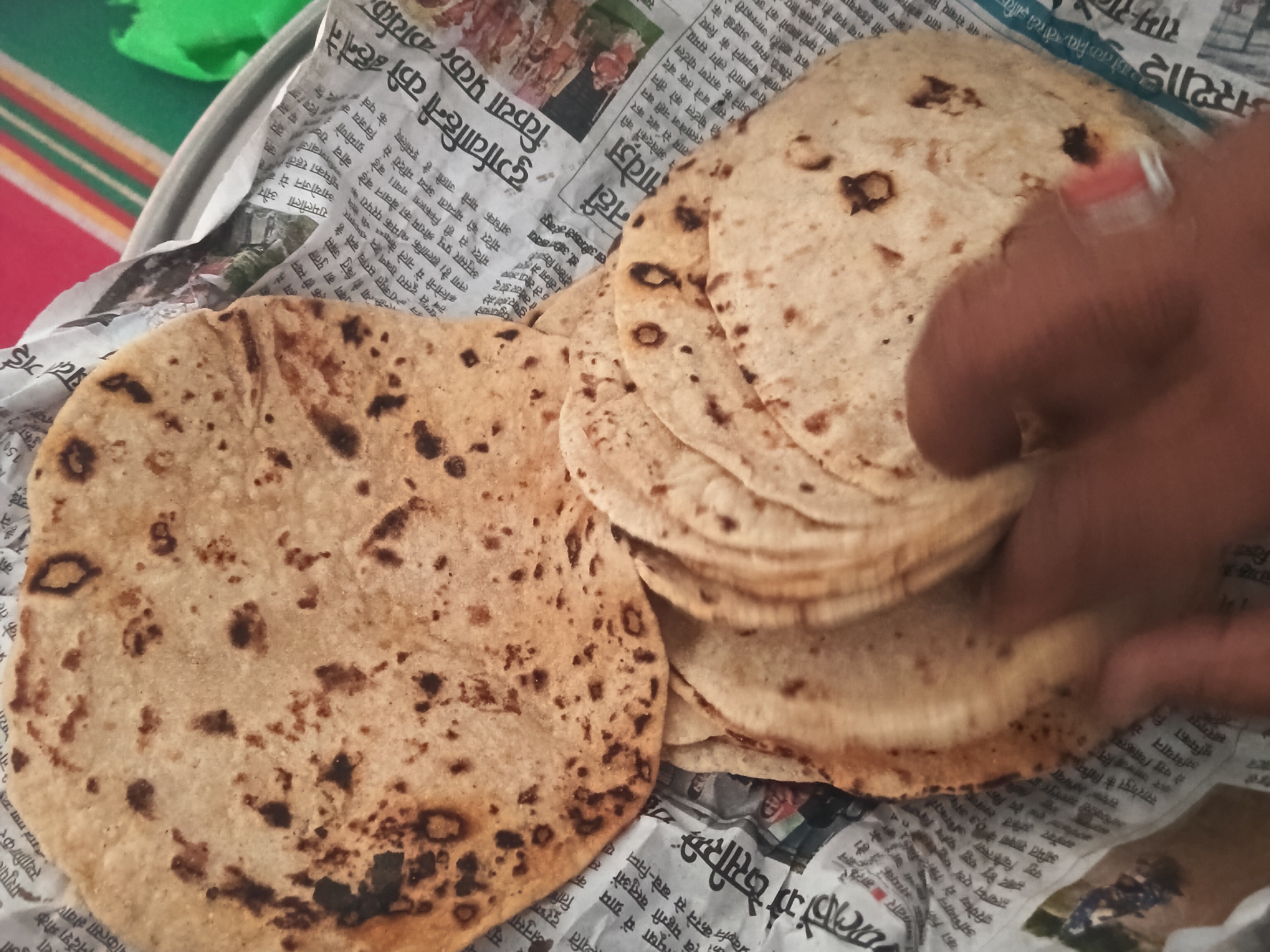 Burnt roti and thin dal served to children in Akodia Anganwadis
