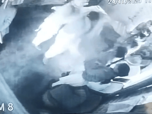 School principal hitting student on knees while pulling her hair.