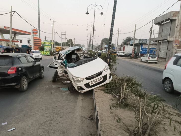 रेवाड़ी में हुए हादसे के बाद डिवाइडर के ऊपर चढ़ी कार।