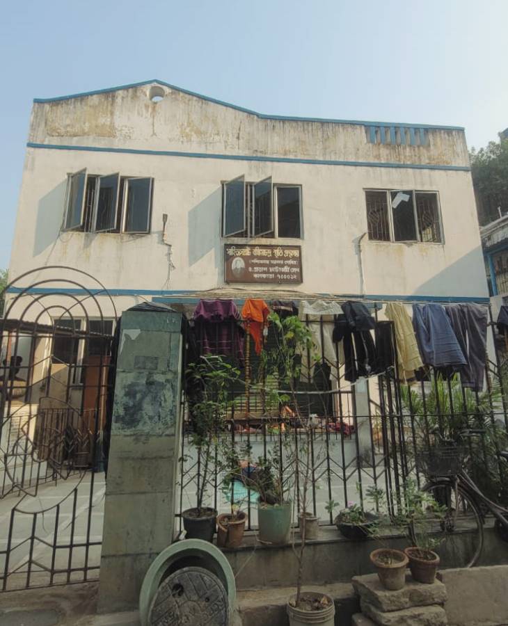 Neighbors' clothes can be seen drying on the grills of Bankim Chandra's house in Kolkata.