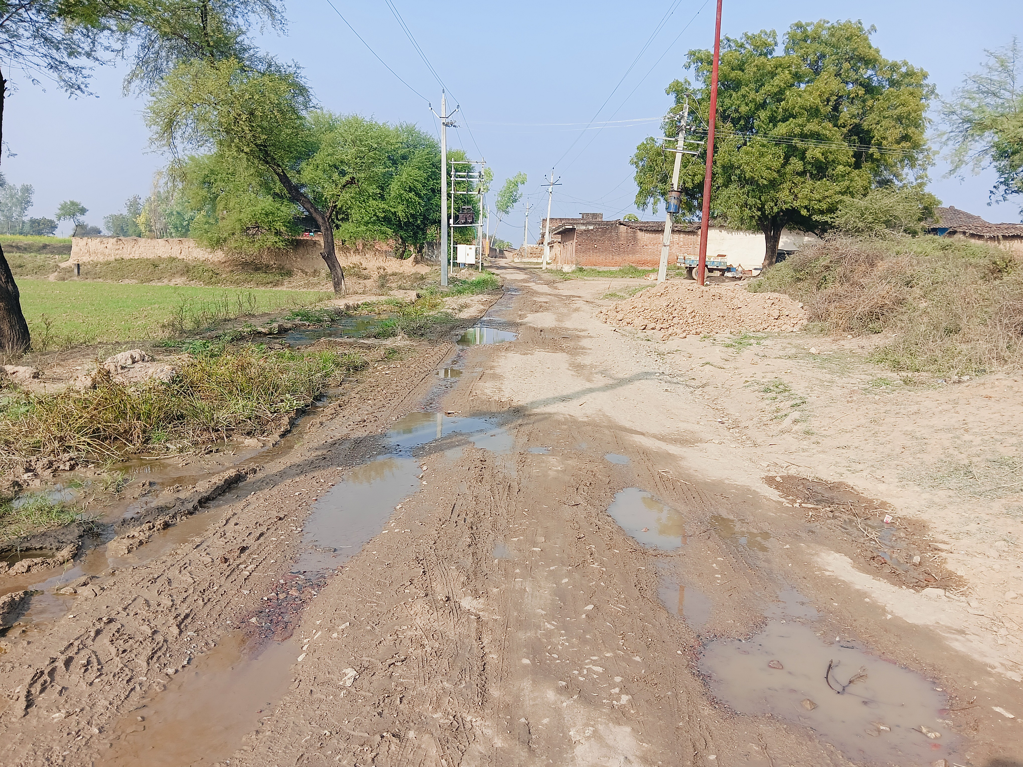 The main road of Bhanpur village is in bad condition.