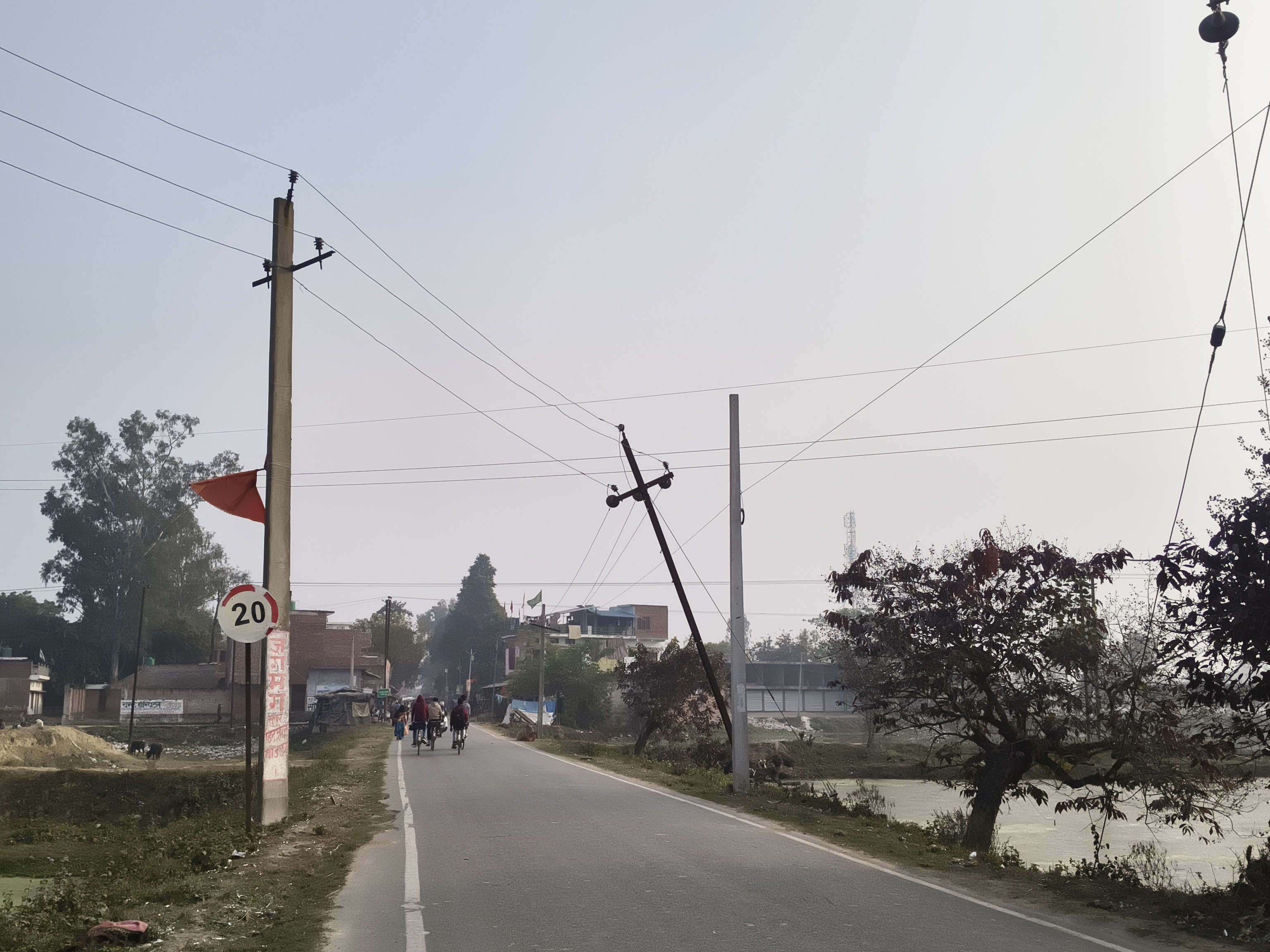 Electric pole hanging in the middle of the road in Barabanki