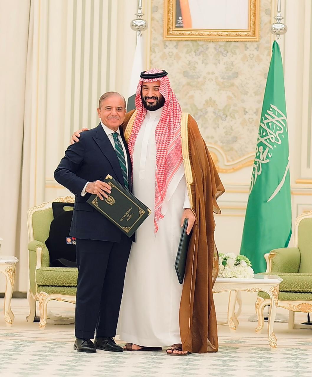 Saudi Crown Prince Mohammed bin Salman and Pakistan PM Shehbaz Sharif hug each other after signing the defense deal.