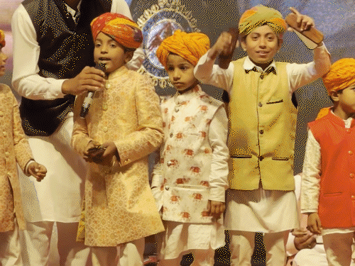 In the program children sang songs in traditional dress of Rajasthan.