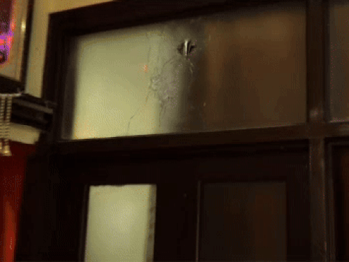 गोली लगने से घर के अंदर शीशा टूटी।