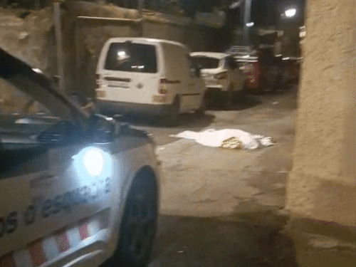 Mukesh's body lying on the street in Barcelona.