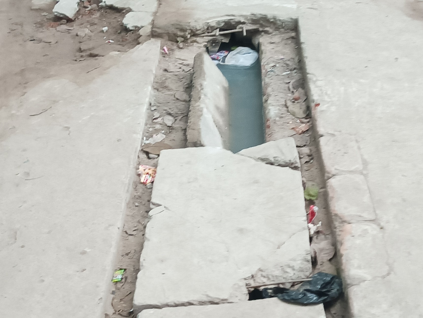 Broken slabs in Vindhyavasini Colony in Bhatpar Rani