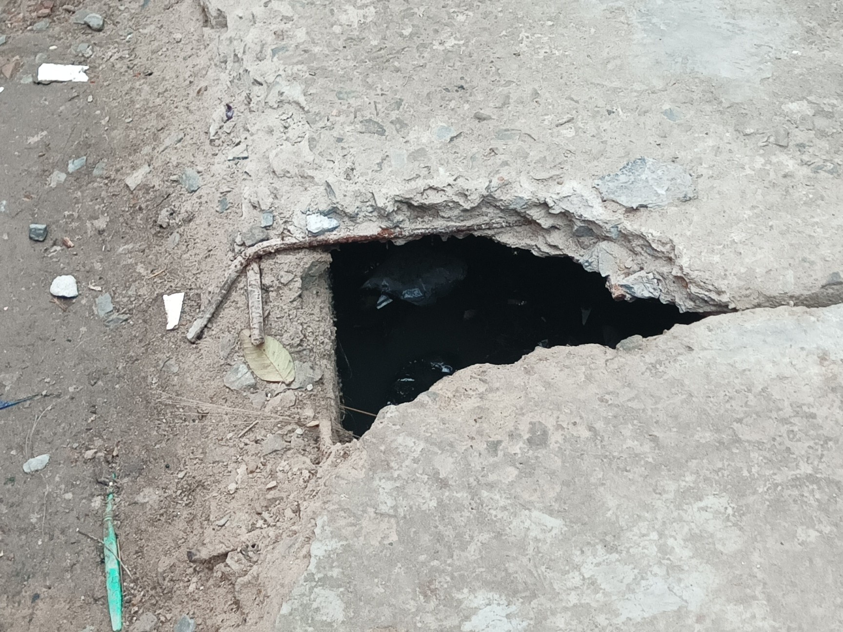 Broken slabs in Vindhyavasini Colony in Bhatpar Rani
