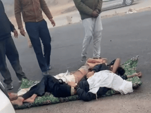 Bodies of the deceased placed on the road after the accident on National Highway in Bathinda.