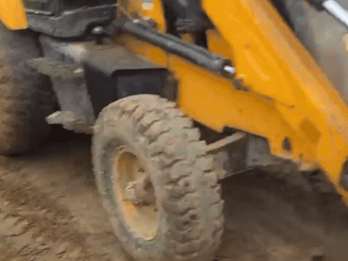 JCB retrieving youth's body from drain in Gurugram.