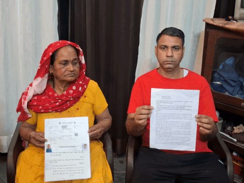 Mother-in-law Kanta and son showing marriage documents.