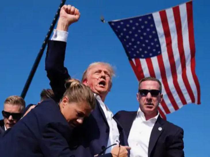 ट्रम्प को गोली लगने के बाद सीक्रेट सर्विस के एजेंट्स ने कवर कर लिया। उनकी हाथ उठाते हुए यह तस्वीर दुनियाभर में वायरल हुई थी।