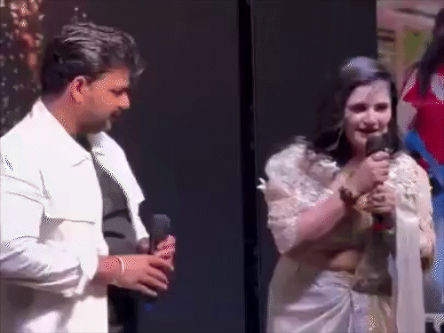 In a program, Pawan Singh was seen touching the waist of an actress on stage.