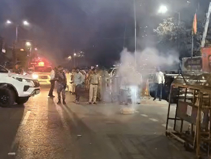 After NDA's victory, workers burst crackers outside the BJP office.