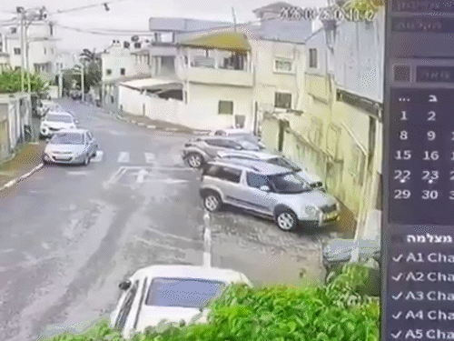 इजराइल पर ईरानी मिसाइल के हमले के बाद एक कार हवा में उड़ गई।