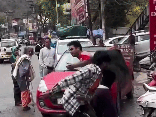 Two young men and a young woman fighting in Rishikesh.
