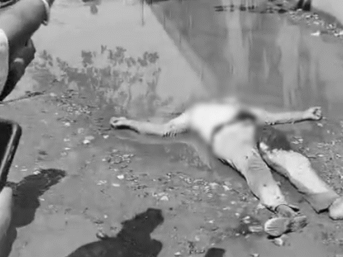 हत्या के बाद जमीन पर बिना सिर के पड़ा धड़।