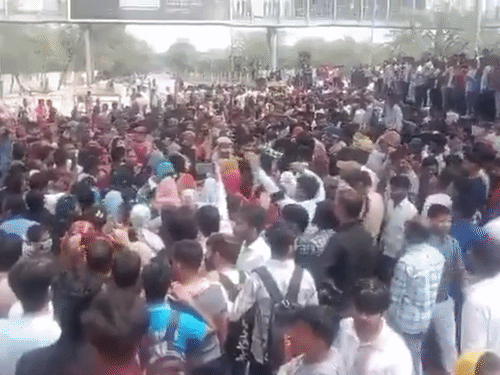 More than 1000 employees protesting in front of a factory in Phase-2 of Noida regarding their demands.