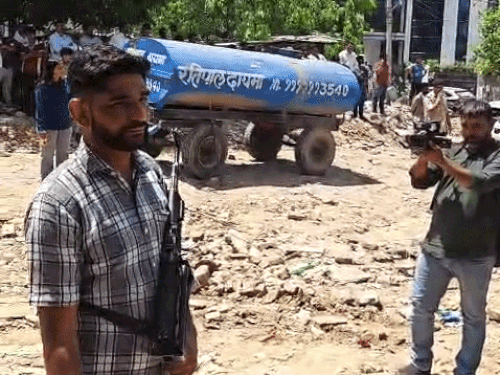 Police are deployed at the scene, and officials are present