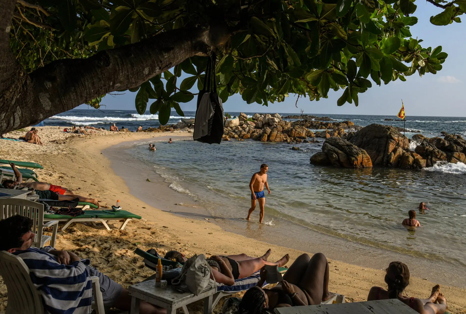 Tourists on a beach in Sri Lanka; There has been a sharp decline in occupancy in many hotels in South Asia.