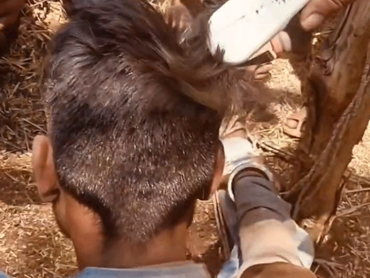 लड़की के परिजन ने युवक को रस्सी से बांधकर मुंडन कर दिया।