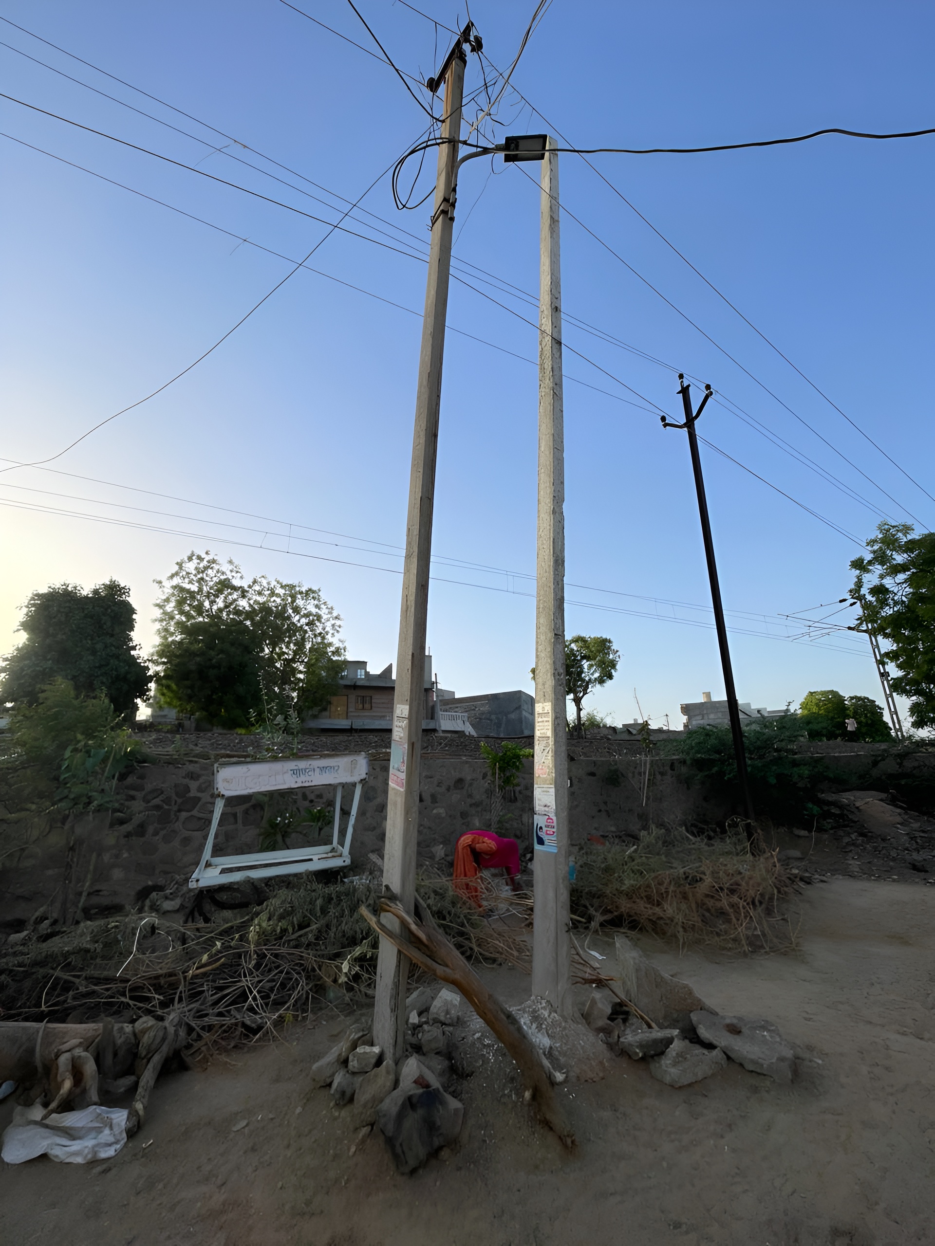 The dilapidated electricity pole is supported by wood, shifting is ...