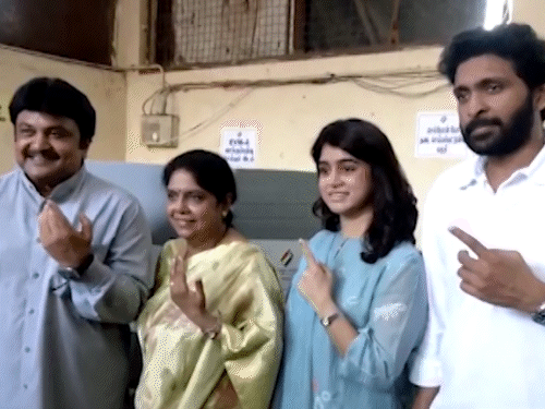 Actor Prabhu posing with son Vikram Prabhu and family after voting.