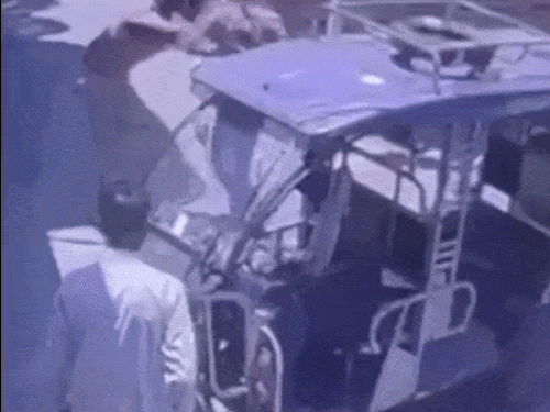 Prisoner Naseeb attempting to escape while being seated in the auto.