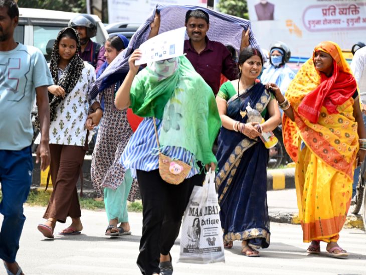 पटना में लोग रविवार को तेज गर्मी से बचने के लिए खुद को ढंककर निकलते नजर आए।